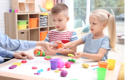Children playing with playdoh for sensory play time