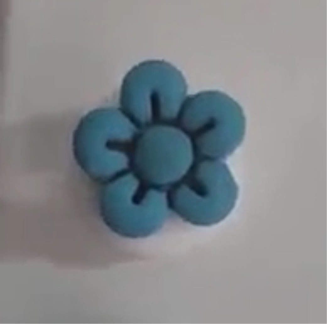Handcrafted polymer clay Straw Cover Caps in a blue flower shape, adding style and preventing spills.