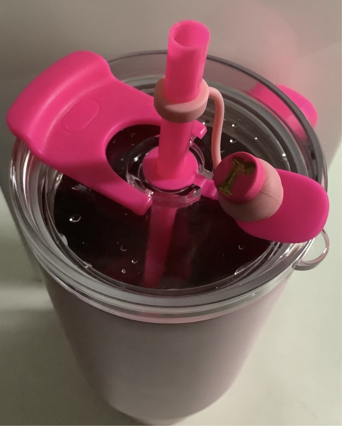 Straw Cover Caps on a drink tumbler, handcrafted polymer clay caps for stylish protection.