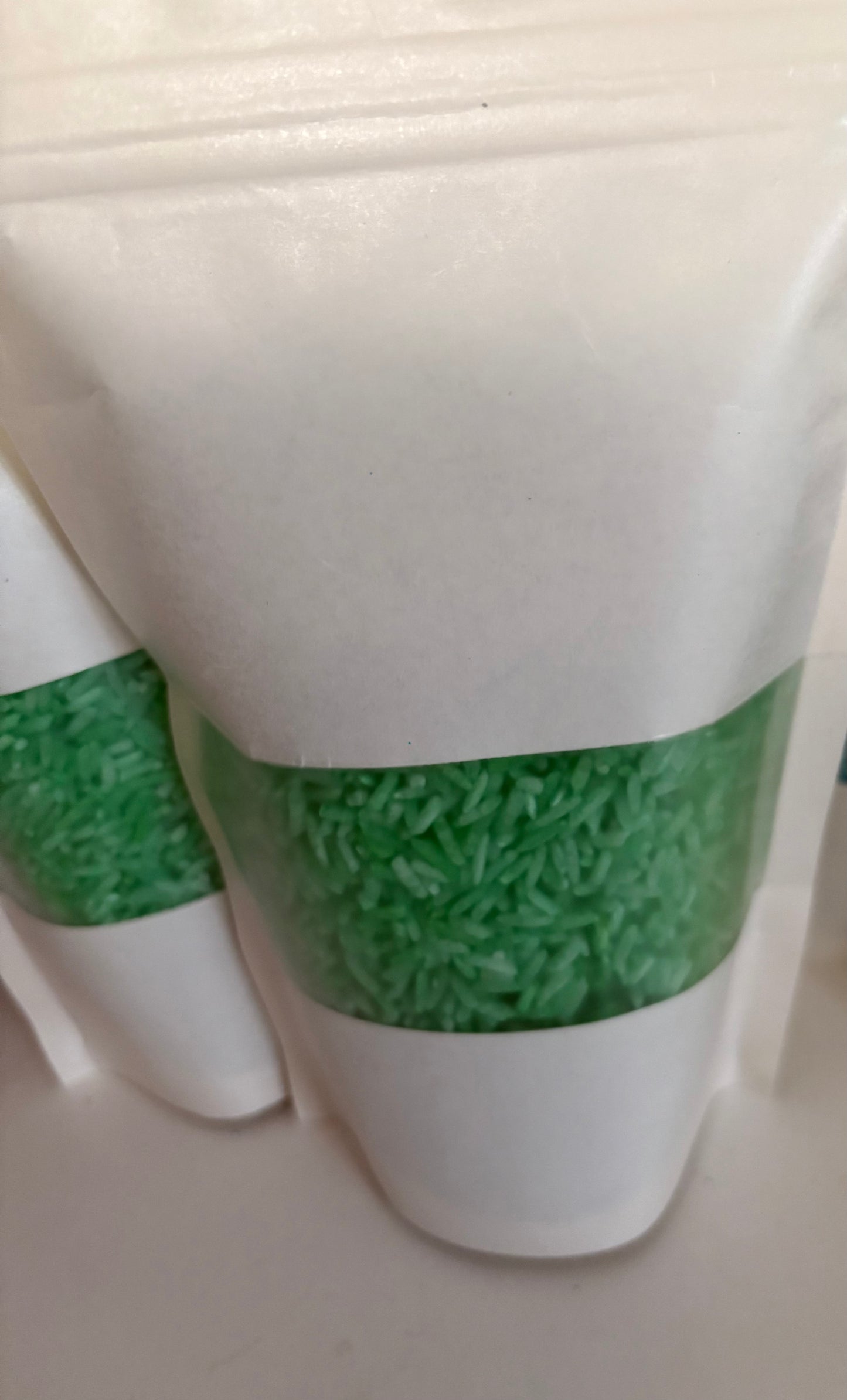 A bag of Krafty Kat Sensory Rice coloured green