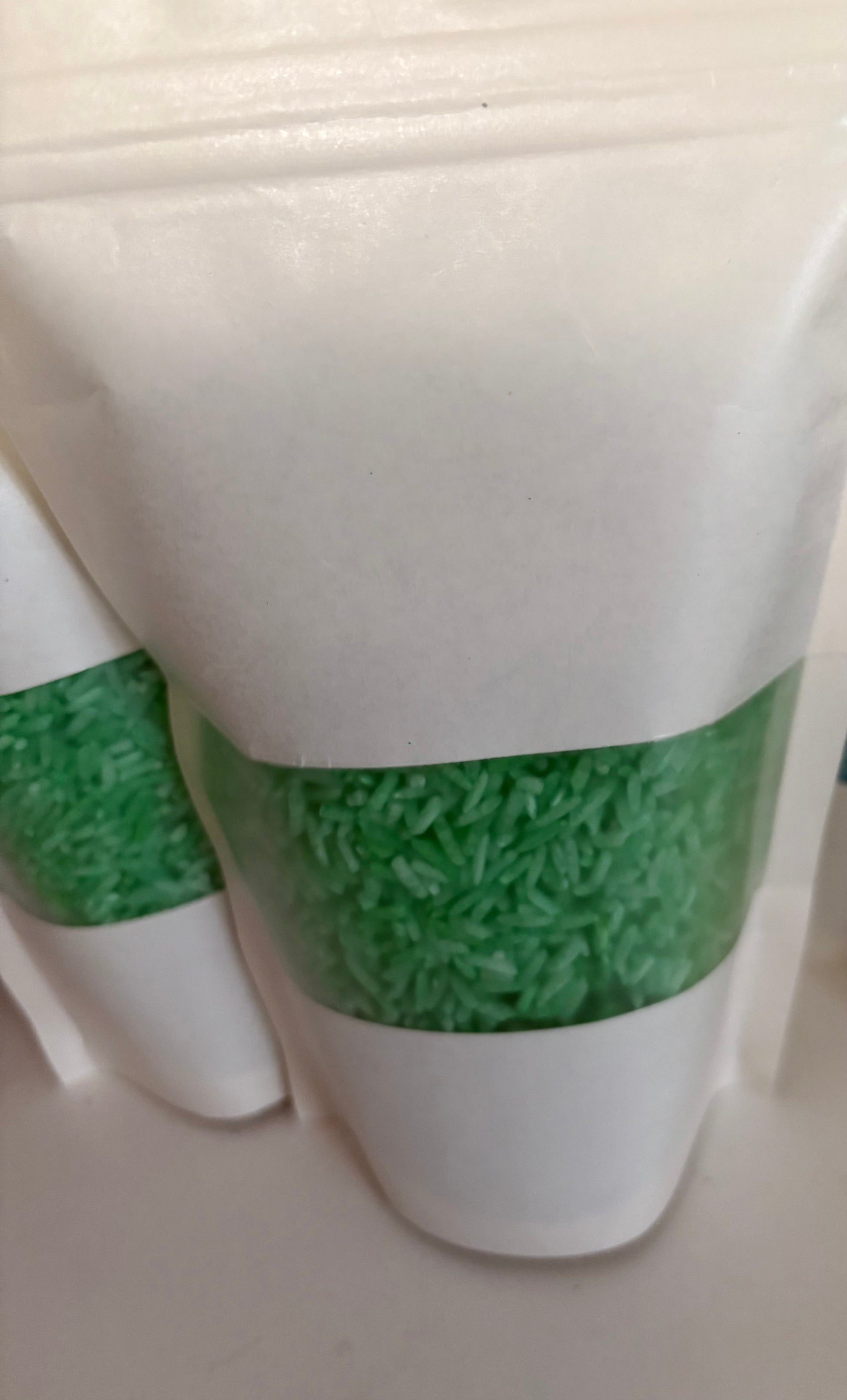 A bag of Krafty Kat Sensory Rice coloured green