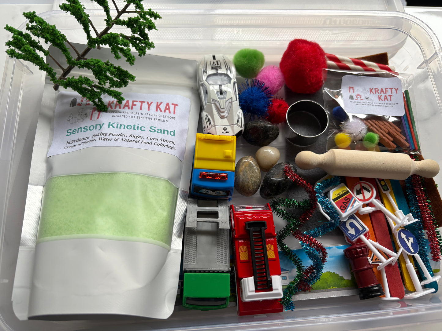 Sensory Kinetic Sand Kit with themed toys and tools in a clear storage container
