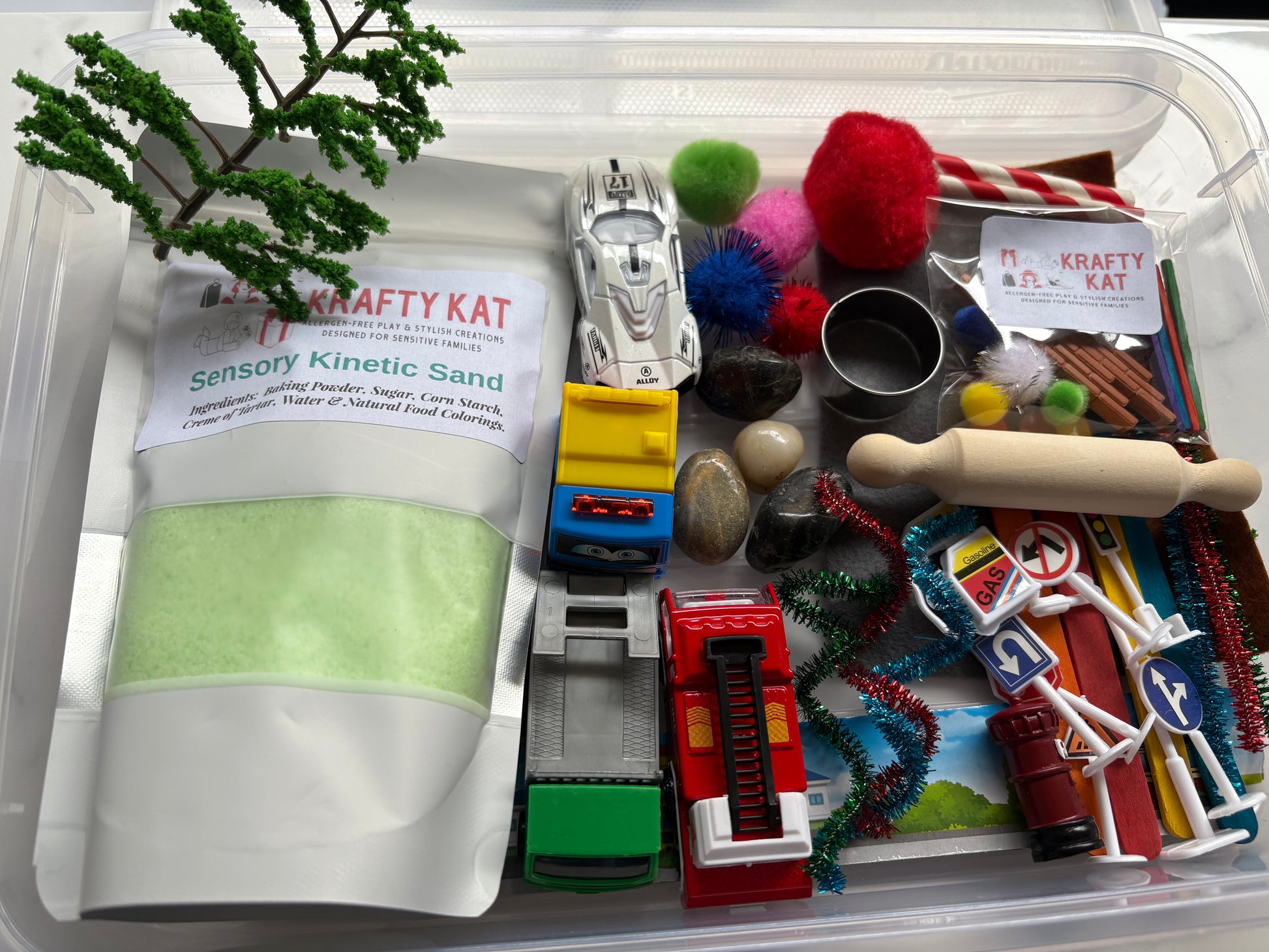 Sensory Kinetic Sand Kit with themed toys and tools in a clear storage container