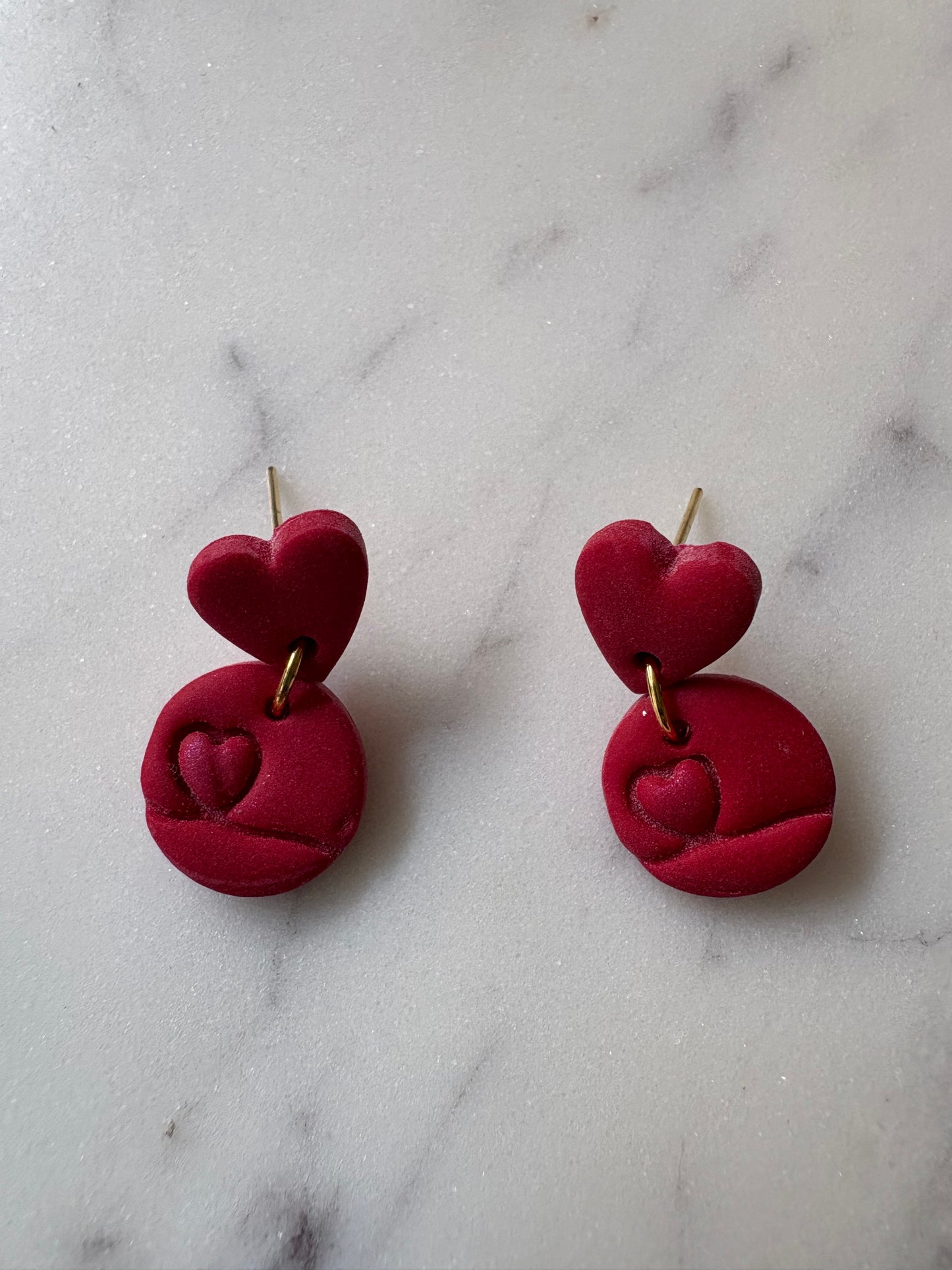 Shimmering Mini Heart Inside a Circle with a Small Red Heart Gold Stud Earrings