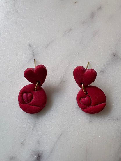 Shimmering Mini Heart Inside a Circle with a Small Red Heart Gold Stud Earrings