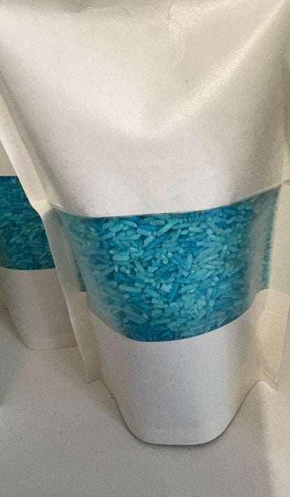 A bag of Krafty Kat Sensory Rice coloured blue