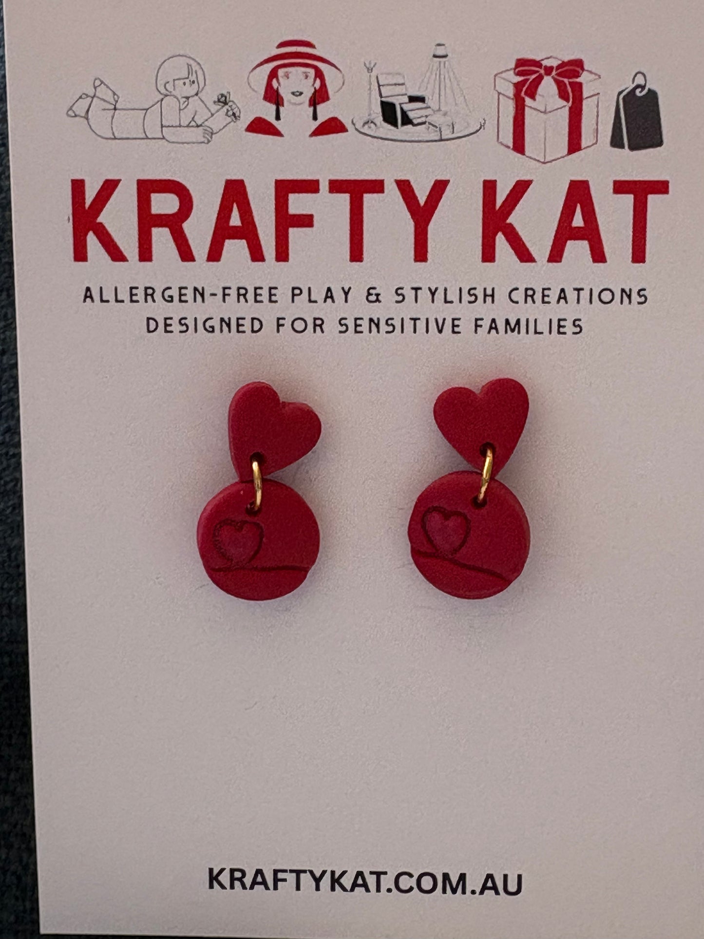 Shimmering Mini Heart Inside a Circle with a Small Red Heart Gold Stud Earrings