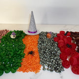 Sensory Mix showing allergen-free coloured chickpeas, rice, white beans & pastas with mini Halloween figurines on top.