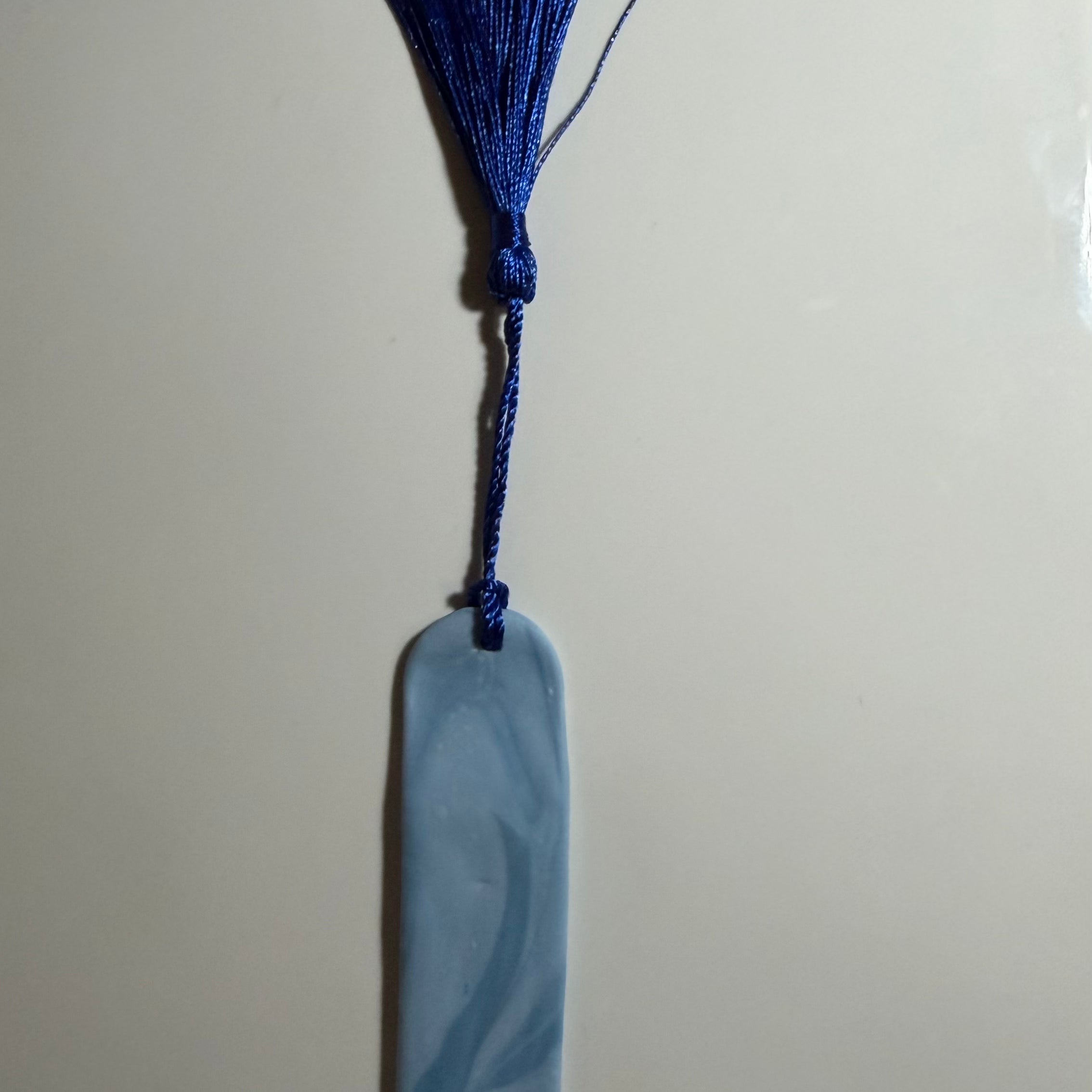 Light Blue Swirl Dog Paw Arch Bookmark