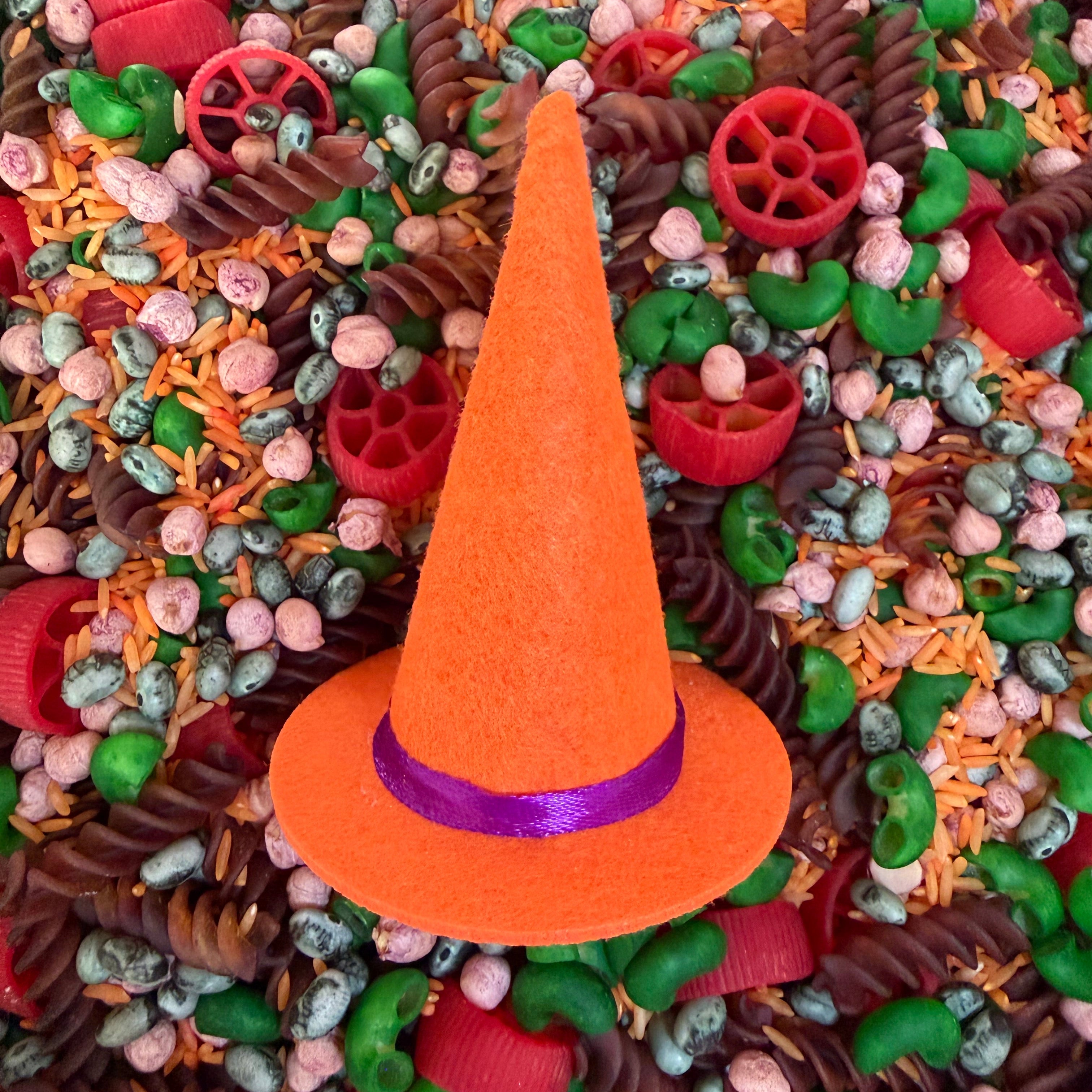 The Halloween Sensory Mix with a bright orange mini witches hat in the middle on top