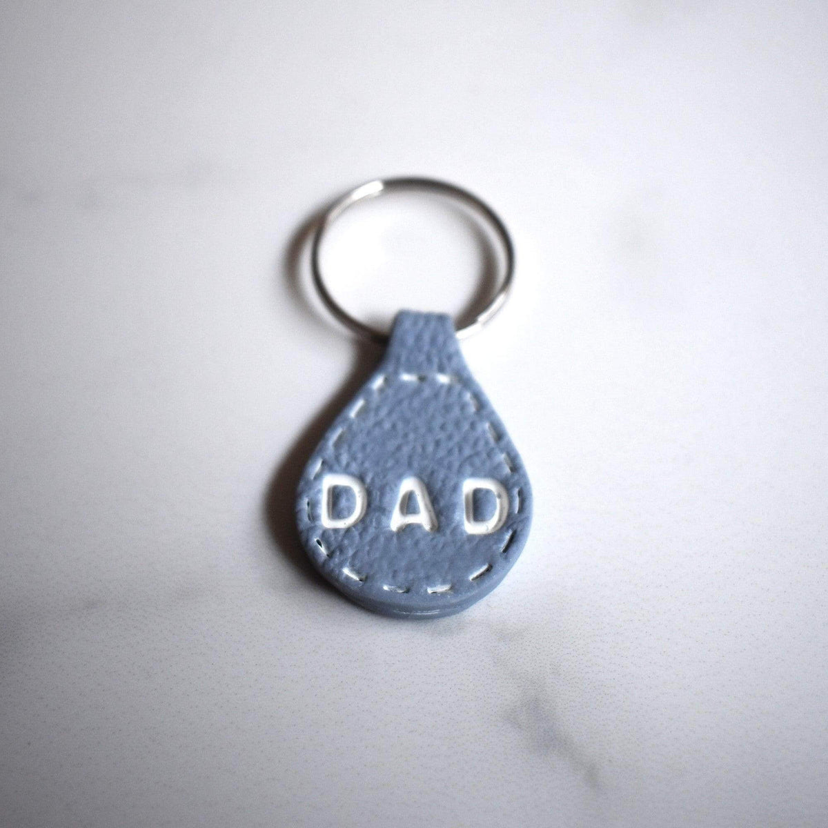 Light Blue Imprinted White ‘Dad’ Leather-Look Silver Keyrings - Krafty Kat