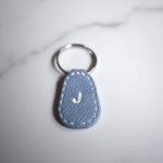 Light Blue Imprinted White ‘J’ Leather-Look Silver Keyrings - Krafty Kat