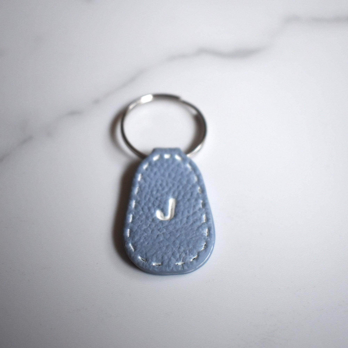 Light Blue Imprinted White ‘J’ Leather-Look Silver Keyrings - Krafty Kat
