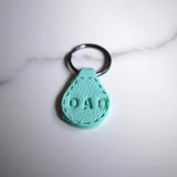 Light Green Imprinted ‘Dad’ Leather-Look Gunmental Keyrings - Krafty Kat